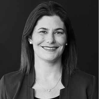 Black and white portrait of Jacqueline Morris, Board Member at Post Acute Analytics, in a dark blazer against a dark background