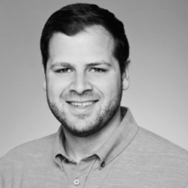 Black and white portrait of Michael Landerer, Board Member at Post Acute Analytics, in a gray polo shirt