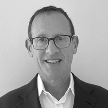 Black and white portrait of Russell Hirsch, M.D., Ph.D., Board Member at Post Acute Analytics, in a dark blazer and glasses